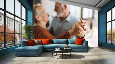 Close-up of two unrecognizable happy mature couple dancing at home Wall mural