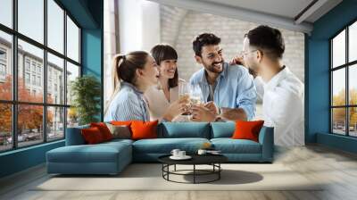 Group of happy business people toasting with wine at office party Wall mural