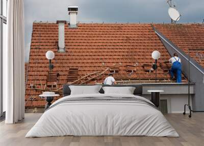 two men working on the roof Wall mural