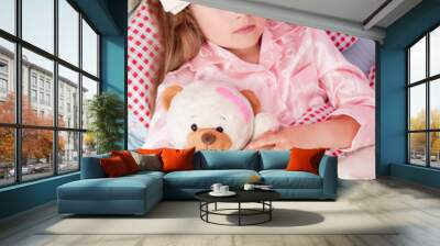 Ill girl with teddy bear in the bed Wall mural