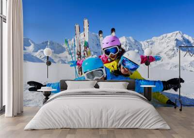 Ski, snow, sun and fun - family enjoying winter Wall mural