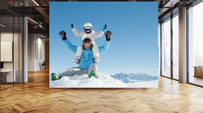 Ski, snow, sun and fun - happy family on ski Wall mural