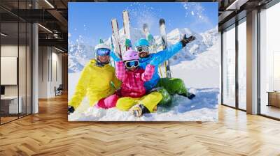 Ski, sun and fun - family enjoying winter holiday Wall mural