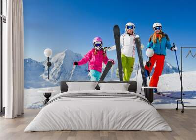 Skiing, winter - happy skiers on mountainside Wall mural