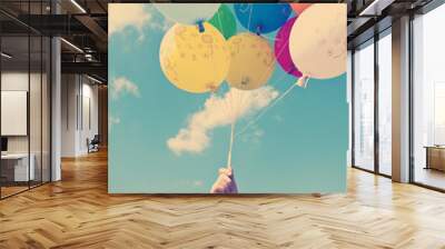 Vintage balloons flying in the sky Wall mural