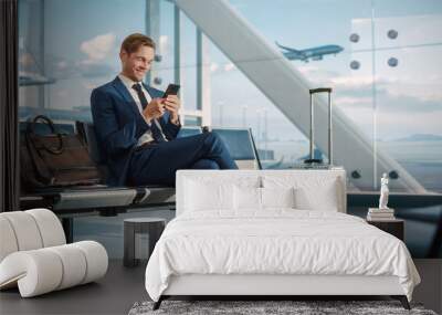 Airport Terminal Flight Wait: Smiling Businessman Uses Smartphone for e-Business, Browsing Internet with an App. Traveling Entrepreneur Work Online on Mobile Phone in Boarding Lounge of Airline Hub Wall mural