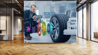 Automotive Engineer Working on Electric Car Chassis, Using Augmented Reality Headset with 3D VFX Application for Development of Regenerative Braking System on a Futuristic Concept Transport Vehicle. Wall mural