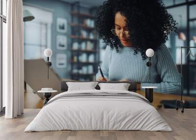 Beautiful Authentic Latina Female Sitting at a Desk in a Cozy Living Room and Following a Video School Lesson on Laptop Computer. Student Studying Remotely. Chat with Friends on Social Network. Wall mural