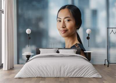 Beautiful Portrait of an Asian Businesswoman in Stylish Black Dress Posing Next to Window in Big City Office with Skyscrapers. Confident Female CEO Smiling. Successful Diverse Business Manager. Wall mural