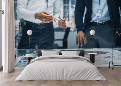 Close Up of Two Automotive Engineers Working in Office at Car Factory. Industrial Designer Shows Conceptual Electric Engine Parts to Colleague, Discussing Work in Technological Laboratory. Wall mural