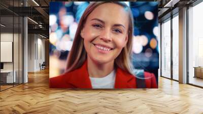 Close Up Portrait of Beautiful Caucasian Woman Smiling, Looking at Camera, Standing in Night City with Bokeh Neon Street Lights. Happy Confident Young Female with Blond Hair and Blue Eyes. Wall mural