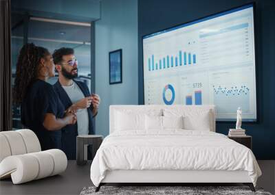 company operations manager holds meeting presentation. black female and hispanic male uses tv screen Wall mural