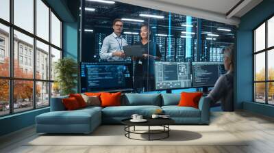 Data Center Black Female e-Business Entrepreneur and White Male IT Specialist talk, Use Laptop. Information Technology Engineer and System Administrator work in Big Cloud Computing Server Farm. Wall mural