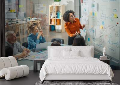 Diverse Modern Office: Black Businesswoman Leads Business Meeting with Managers, Talks, Explains Statistics, Uses a Whiteboard with Graphs, Big Data. Digital Entrepreneurs Work on eCommerce Project Wall mural