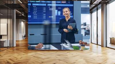 Diverse Modern Office: Portrait of Successful Caucasian Businesswoman Uses TV Screen with Big Data, Statistics, Talks about Company Growth. Creative Digital Entrepreneurs Work on e-Commerce Project Wall mural