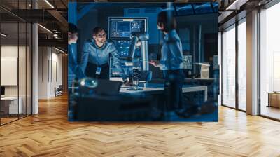 Diverse Team of Engineers with Laptop and a Tablet Analyse and Discuss How a Futuristic Robotic Arm Works and Moves a Metal Object. They are in a High Tech Research Laboratory with Modern Equipment. Wall mural