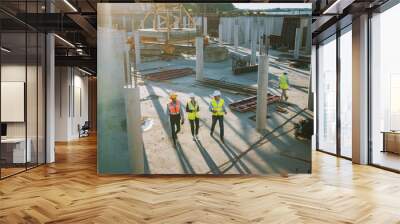 Diverse Team of Specialists Taking a Walk Through Construction Site. Real Estate Building Project with Senior Civil Engineer, Architect, General Worker Discussing Planning and Development Details. Wall mural