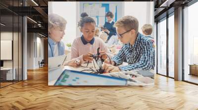 Elementary School Robotics Classroom: Diverse Group of Brilliant Children with Enthusiastic Teacher Building and Programming Robot. Kids Learning Software Design and Creative Robotics Engineering Wall mural