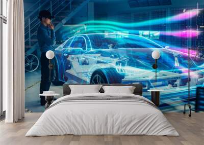 Engineer Wearing Augmented Reality Headset Working on New Electric Car Chassis Platform. 3D Graphics Visualization Virtual Model of a Vehicle is Tested in Digital Wind Tunnel. Wall mural