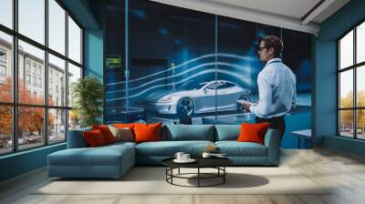 Engineering Research Agency Perform Aerodynamic Testing with a Modern Eco-Friendly Electric Sports Car in a Wind Tunnel. Professional Scientist Works on a Tablet Computer and Changes Testing Options. Wall mural