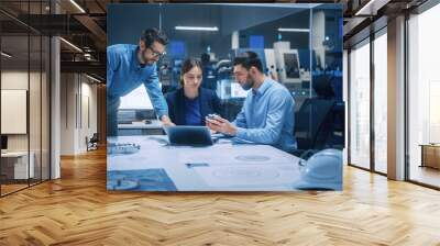 Factory Office Meeting Room: Team of Engineers Gather Around Conference Table, They Discuss Project Blueprints, Inspect Mechanism, Find Solutions, Use Laptop. Industrial Technology Factory Wall mural