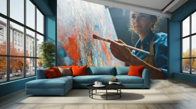 Female Artist Works on Abstract Oil Painting, Moving Paint Brush Energetically She Creates Modern Masterpiece. Dark Creative Studio where Large Canvas Stands on Easel Illuminated. Low Angle Close-up Wall mural