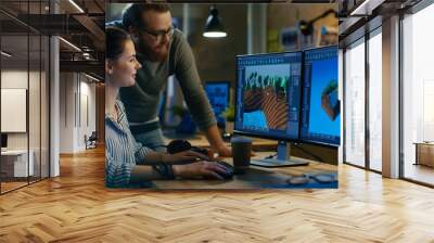 Female Game Developer Has Discussion with Male Project Manager While Working on a Game Level on Her Personal Computer with Two Displays. They Work in a Modern Loft Office Creative Environment. Wall mural