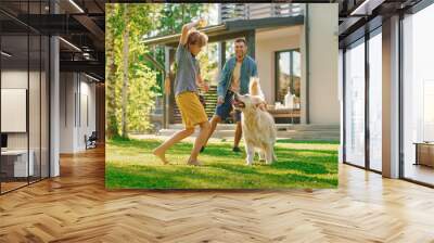 Handsome Father, and Son Play Catch With Loyal Family Friend Golden Retriever Dog. Family Spending Time Together Training Dog. Sunny Day Idyllic Suburban Home Backyard. Wall mural