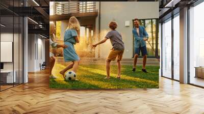 Happy Family of Four Playing with Garden Water Hose, Spraying Each Other. Mother, Father, Daughter and Son Have Fun Playing Games in the Backyard Lawn of Idyllic Suburban House on Sunny Summer Day Wall mural