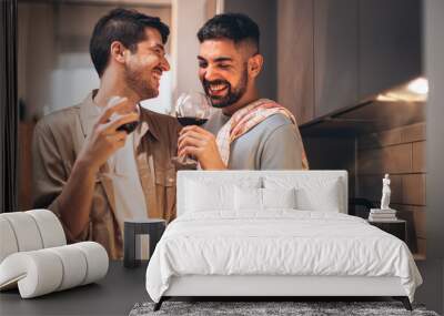 Happy Gay Couple in Love Drink Wine, Chat, Prepare Delicious Dinner Meal. Two Boyfriends Have Lovely Romantic Evening. Partners Talk, Share Beautiful Moments. Portrait Shot Wall mural