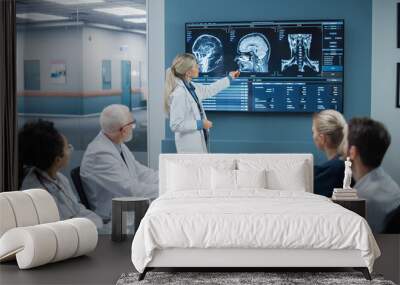 Hospital Conference Meeting Room: Female Physician Presents Patient X-Ray on TV Screen, Team of Medical Doctors Discuss Patient Treatment. Research Scientists Talk of Cure, Drug, Medicine Development Wall mural