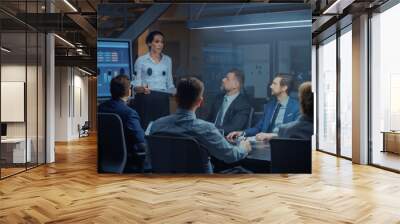 In the Corporate Meeting Room: Female Executive Talks and Uses Digital Interactive Whiteboard for Presentation to a Board of Directors, Investors. Screen Shows Growth Data. Late at Night Office Wall mural