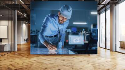 Industry 4.0 Modern Factory Office Meeting Room: Handsome Male Engineer Wearing Hardhat, Uses Pen on Touchscreen Digital Table to Correct, Draw Machinery Blueprints. High-Tech Electronics Facility  Wall mural