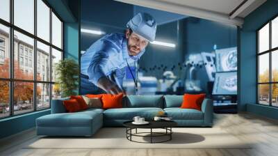 Industry 4.0 Modern Factory Office Meeting Room: Handsome Male Engineer Wearing Hardhat, Uses Pen on Touchscreen Digital Table to Correct, Draw Machinery Blueprints. High-Tech Electronics Facility  Wall mural