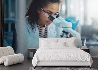 Medical Science Laboratory: Portrait of Beautiful Black Scientist Looking Under Microscope Does Analysis of Test Sample. Ambitious Young Biotechnology Specialist, working with Advanced Equipment Wall mural