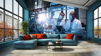 Modern Medical Research Laboratory: Two Scientists Wearing Face Masks use Microscope, Analyse Sample in Petri Dish, Discuss Innovative Technology. Advanced Scientific Lab for Medicine, Biotechnology Wall mural