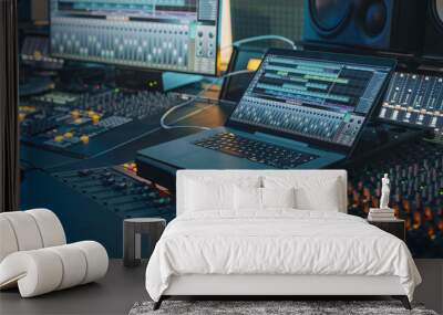 modern music record studio control desk with laptop screen showing user interface of digital audio w Wall mural