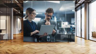 Multicultural Chief Technology Officer Talking to Software Developer, Discussing Neural Network Updates in High Tech Research and Development Facility. Professional Computer Specialists at Work Wall mural