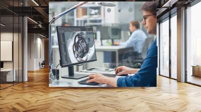 Over the Shoulder Shot of Engineer Working with CAD Software on Desktop Computer, Screen Shows Technical Details and Drawings. In the Background Engineering Facility Specialising on Industrial Design Wall mural