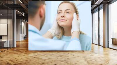 Plastic / Cosmetic Surgeon Examines Beautiful Woman's Face, Touches it with Gloved Hands, Inspecting Healed Face after Plastic Surgery with Amazing Results. Wall mural