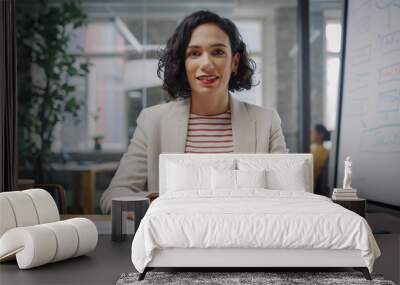 Point of View from Camera Portrait of Beautiful Multiethnic Latina Project Manager Having Video Call in Creative Office Environment. Happy Female Specialist Listening to a Colleague Over Live Camera. Wall mural