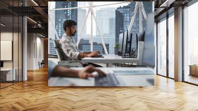 Portrait of a Young Indian Business Account Manager Working on a Desktop Computer in a Modern Corporate Office. Manager Dealing with Financial Reports, Preparing a Growth Plan for the Company Wall mural