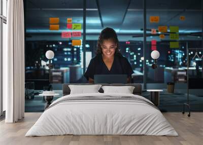 Portrait of African American Businesswoman Working on Laptop Computer in Big City Office Late in the Evening. Female Executive Director Managing Digital e-Commerce Project, Finance Analysis Wall mural