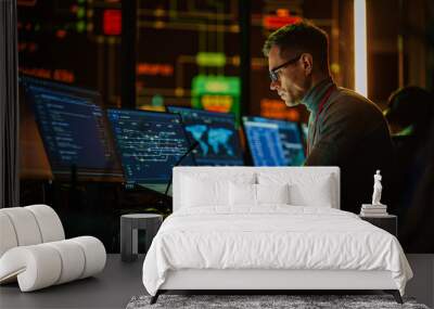 Professional IT Technical Support Specialist Making an Intercom Announcement on a Microphone and Working on Desktop Computer in Monitoring Control Room with Big Digital Screens with Server Data. Wall mural