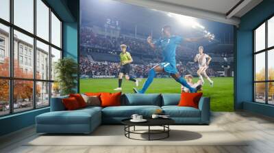 Professional Soccer Football Match Championship: Blue Team Attacks, Black Forward Masterfully Dribbles on an International Tournament. Stadium of Fans Cheers. Beautiful Cinematic Edit. Wall mural