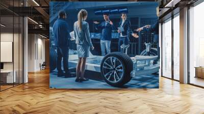 Shot of International Team of Automobile Design Engineers Introducing Futuristic Autonomous Electric Car Platform Chassis to a Group of Investors and Businesspeople. Wall mural