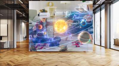 Smart Little Boy Wearing Virtual Reality Headset and Looking at Our Digitally Generated Solar System with Sun and Planets. Space Exploration with AR Glasses. He's Sitting on Carpet in His Living Room. Wall mural