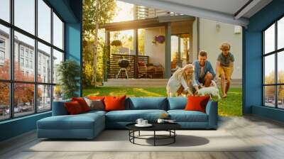 Smiling Father, Mother and Son Pet and Play with Smooth Fox Terrier Retriever Dog. Sun Shines on Idyllic Happy Family with Loyal Pedigree Dog have Fun at the Idyllic Suburban House Backyard Wall mural