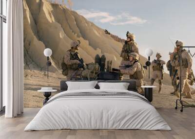 Soldiers are Using Laptop Computer for Surveillance During Military Operation in the Desert. Wall mural