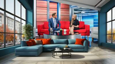 Talk Show TV Program and News Discussion: Two Cheerful Presenters Talk, Have Fun. Cable Channel Hosts Have Friendly Conversation. Mock-up Television Studio and Newsroom Entertainment Concept Wall mural